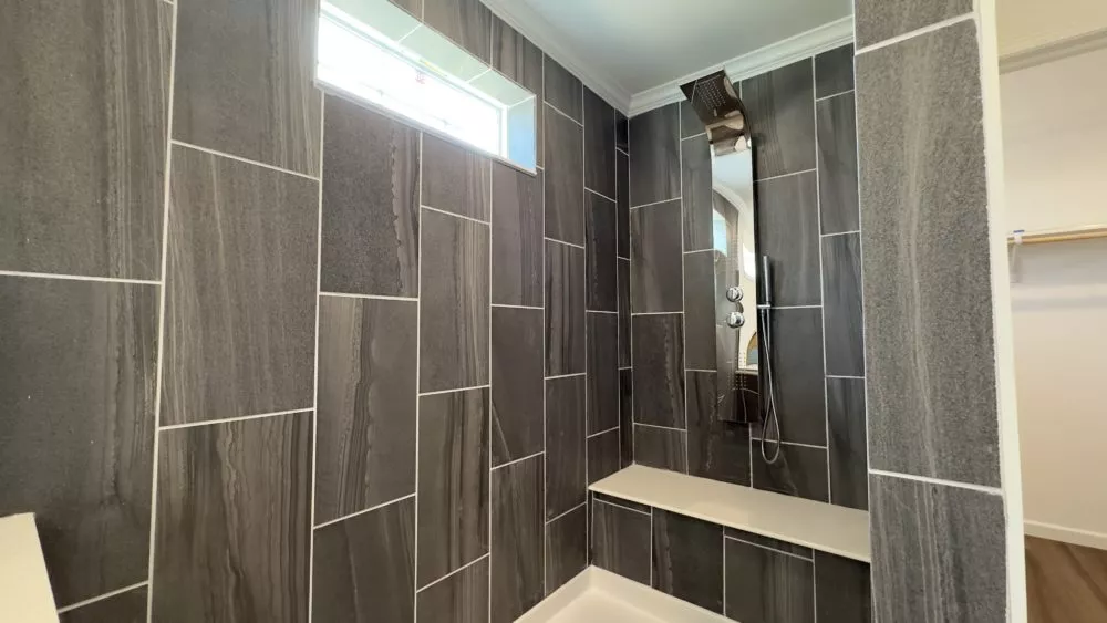 The walk-in shower to The Molly sporting an elegant design for 2025