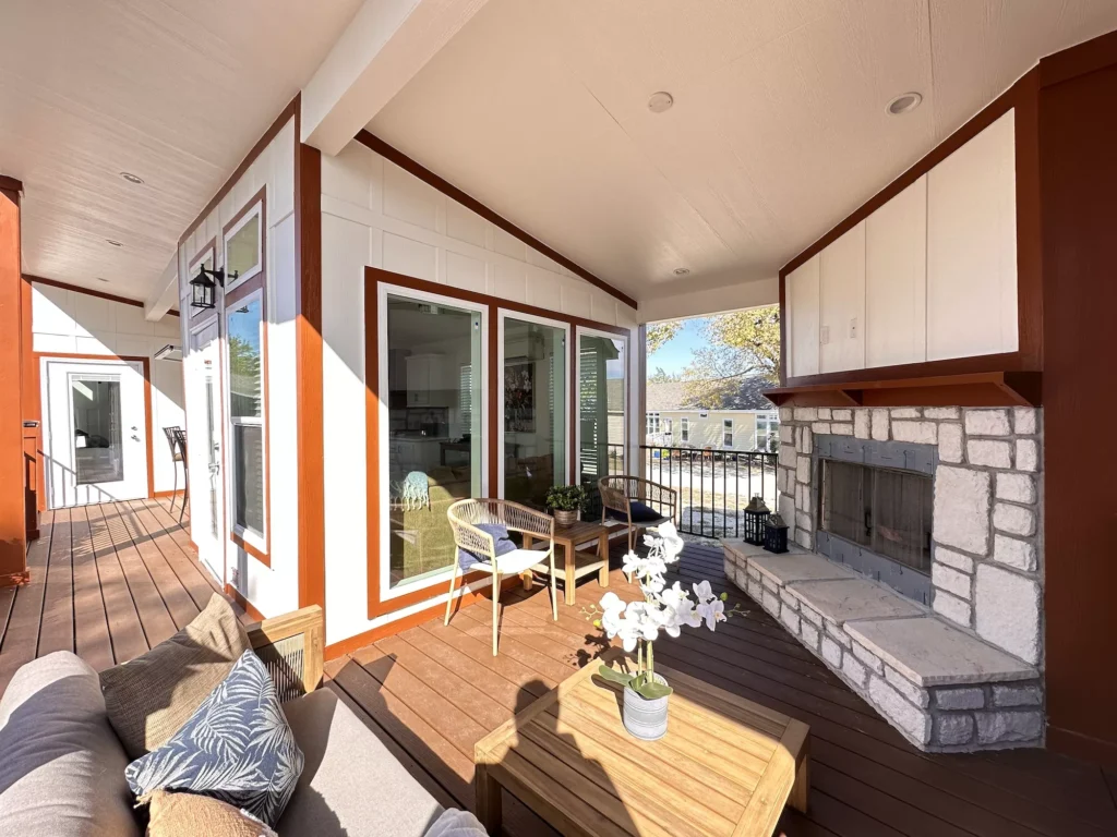The outside of The Rosie with a huge porch and fireplace to bring the outdoors closer to you.